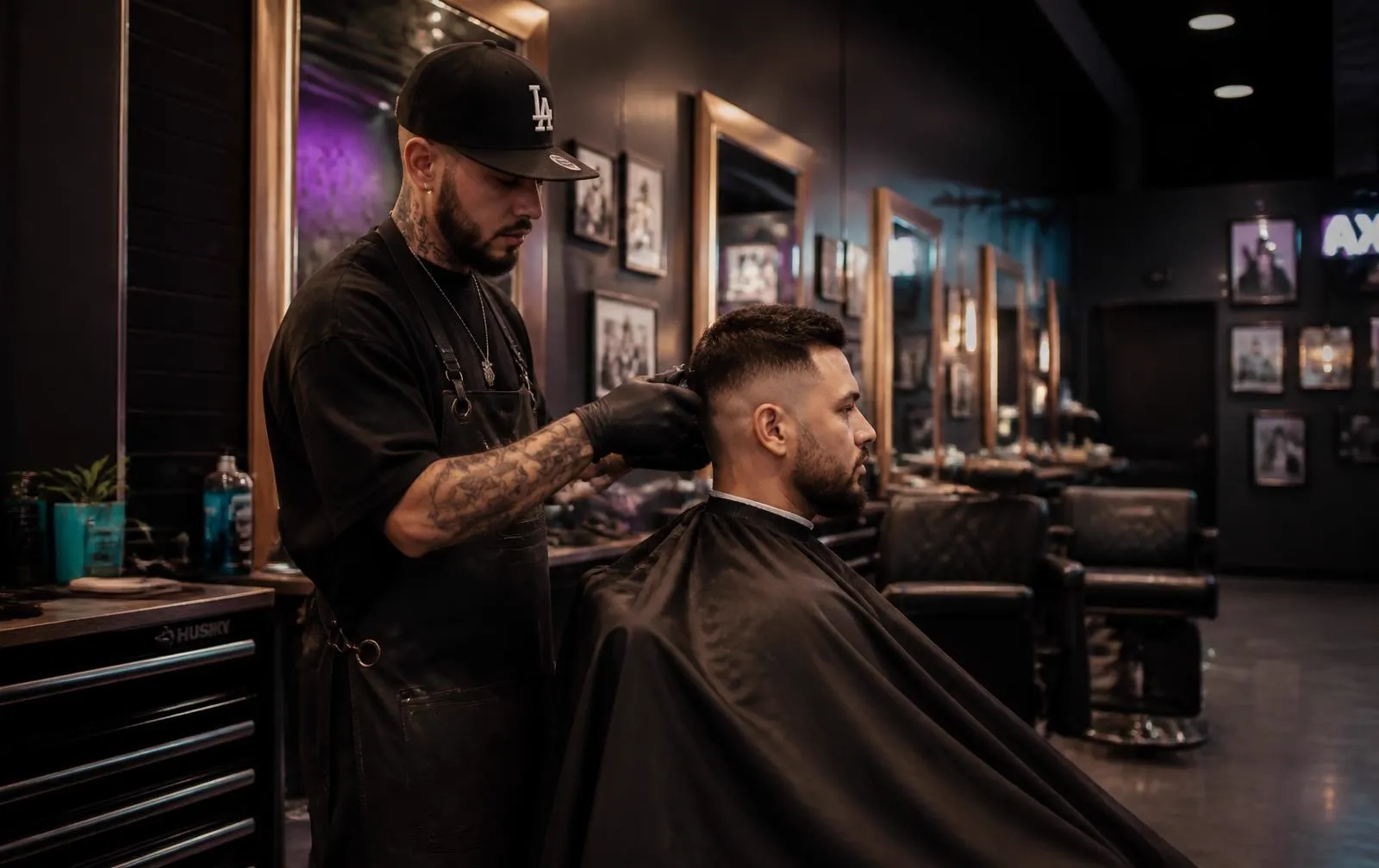 Barber finishing a skin fade at the chair in a Canadian barbershop